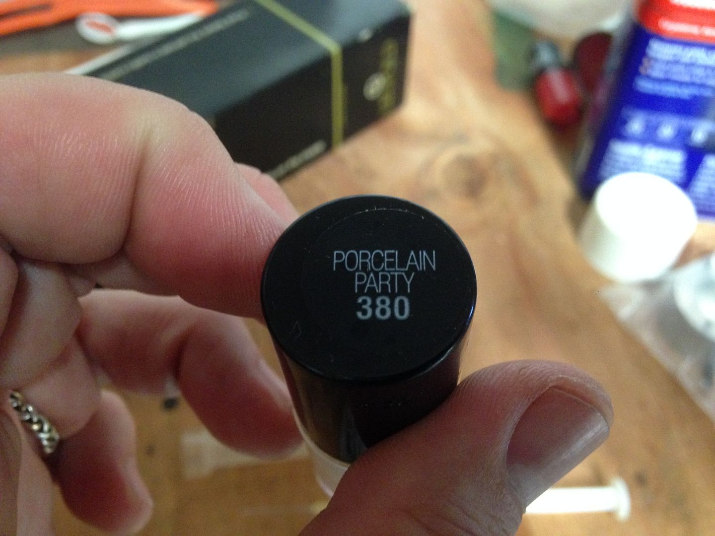 Painting emblems using lacquer paint and a hypodermic syringe The